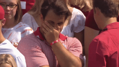 Man In Red And White Striped Shirt Covering Face GIF