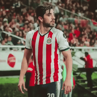 Man In Red And White Striped Shirt Number 20 GIF
