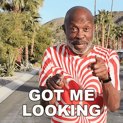 Man In Red And White Striped Shirt Pointing Says Got Me Looking GIF