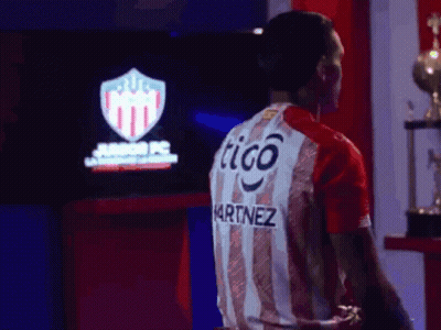 Man In Red And White Striped Shirt Saying Tigo Martinez GIF