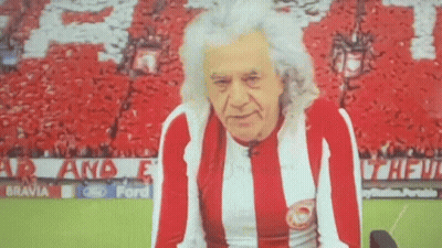 Man In Red And White Striped Shirt With Crowd GIF