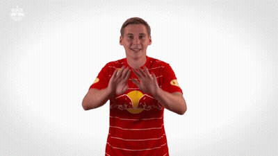 Man In Red And White Striped Shirt With Red Bull GIF