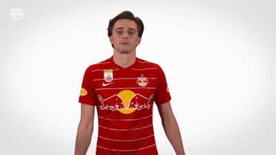 Man In Red And White Striped Shirt With Red Bulls GIF