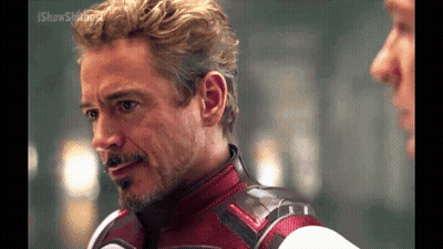 Man In Red And White Suit Talking To Another Man GIF