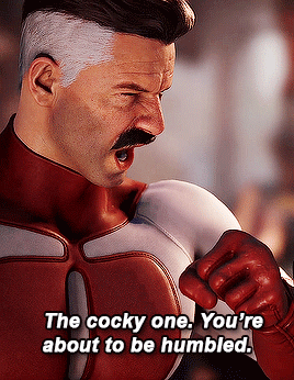 Man In Red And White Superhero Costume Saying The Cocky One You're About To Be Humbled GIF