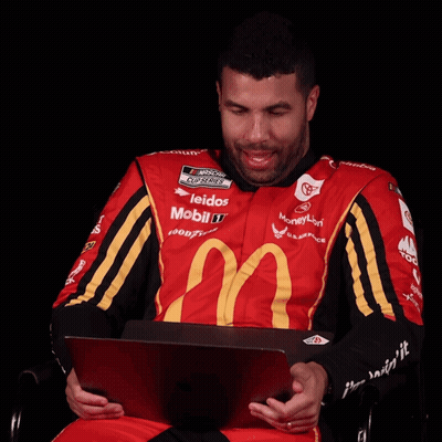 Man In Red And Yellow McDonald's Shirt Looking At Laptop GIF
