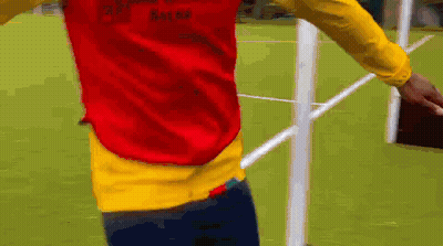 Man In Red And Yellow Vest Saying Ghana GIF