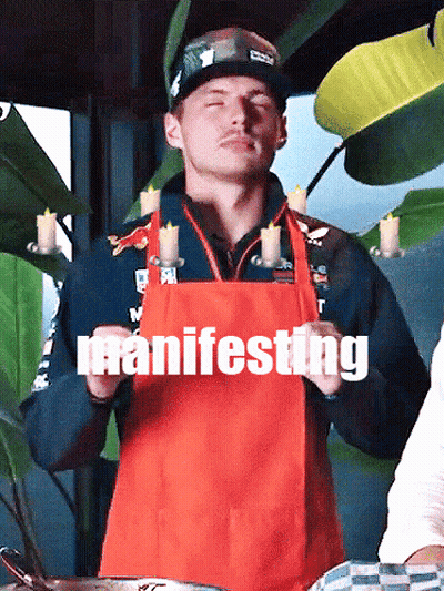 Man In Red Apron Holding Candles Manifesting GIF