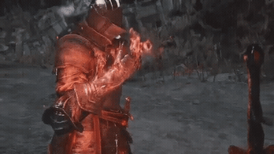 Man In Red Armor And Helmet Holding Sword GIF
