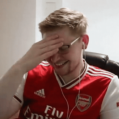 Man In Red Arsenal Jersey Covering Face Headphones GIF