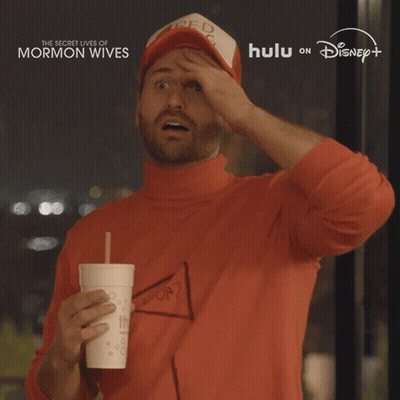 Man In Red Bag Hat Holding Drink GIF