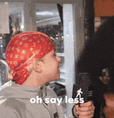 Man In Red Bandana Holding Mic Saying Oh Say Less GIF