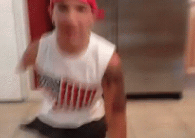 Man In Red Bandana Sitting On Kitchen Floor GIF