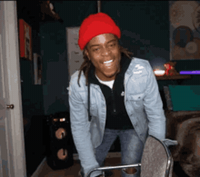 Man In Red Beanie And Denim Jacket Smiling GIF