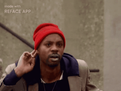 Man In Red Beanie Making Funny Face With Fingers In Ears GIF