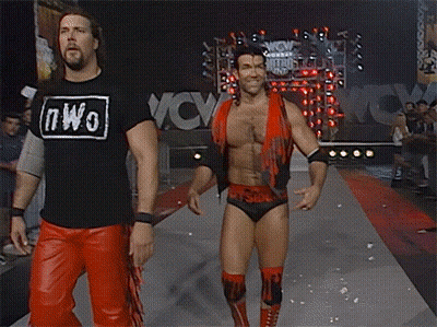 Man In Red Black Flaming Vest On Phone GIF