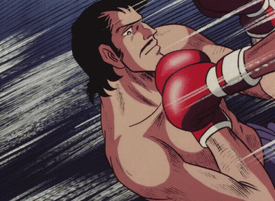 Man in Red Boxing Gloves Being Hit
