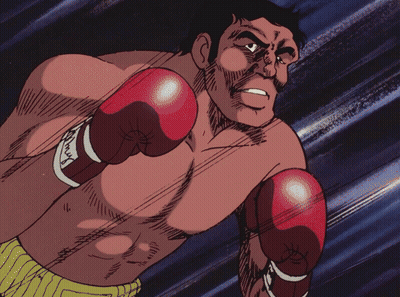 Man in Red Boxing Gloves With Max on Wrist