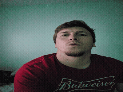 Man In Red Budweiser Shirt Looking Down GIF