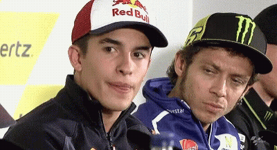 Man In Red Bull Hat Beside Monster Hat GIF