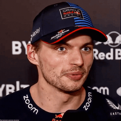 Man in Red Bull Hat Looking at Camera
