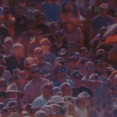 Man In Red Bull Hat Smiling At Crowd GIF