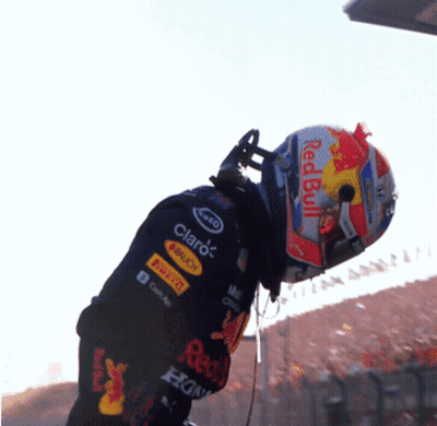 Man In Red Bull Helmet And Claro Shirt GIF