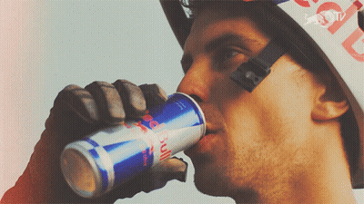 Man In Red Bull Helmet Drinking Red Bull GIF