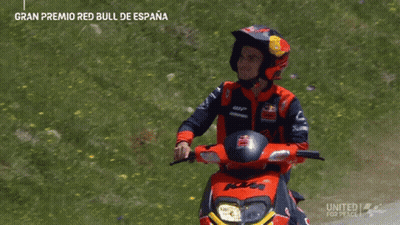 Man In Red Bull Helmet Riding Motorcycle GIF