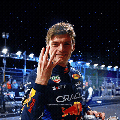 Man In Red Bull Racing Jacket Waving GIF