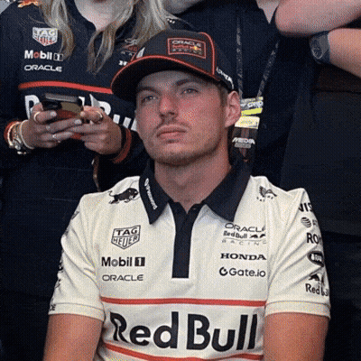 Man In Red Bull Shirt And Baseball Cap GIF