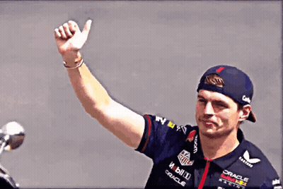 Man In Red Bull Shirt And Red Hat Waving GIF
