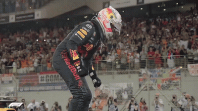 Man In Red Bull Shirt Holding Steering Wheel Over Face GIF