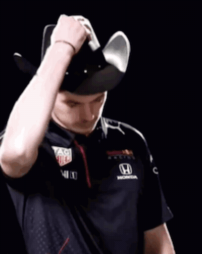 Man In Red Bull Shirt Holding Steering Wheel Over Face GIF