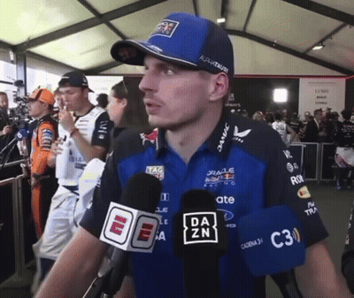 Man In Red Bull Shirt Talking Into Microphone GIF