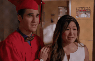 Man In Red Cap And Gown Beside Crying Woman GIF