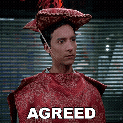 Man In Red Cape And Hat Saying Agreed GIF