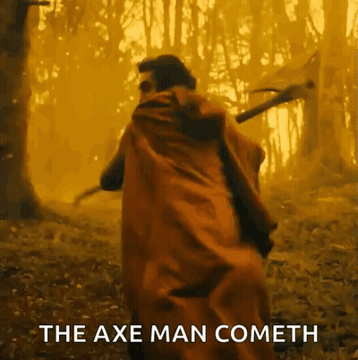 Man In Red Cape Holding Axe In Forest GIF