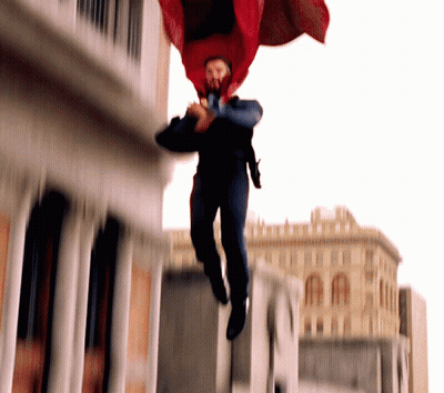 Man In Red Cape Jumping GIF