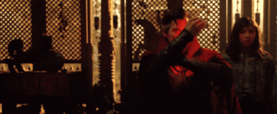 Man In Red Cape Next To Woman GIF