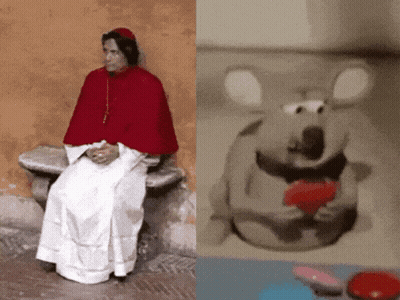 Man In Red Cape Sitting Beside Stuffed Animal GIF