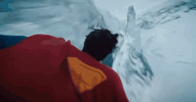 Man In Red Cape Standing By Water GIF
