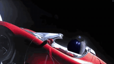 Man In Red Car Flying In Space GIF
