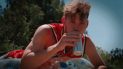 Man In Red Chicago Bulls Jersey Drinking Soda GIF