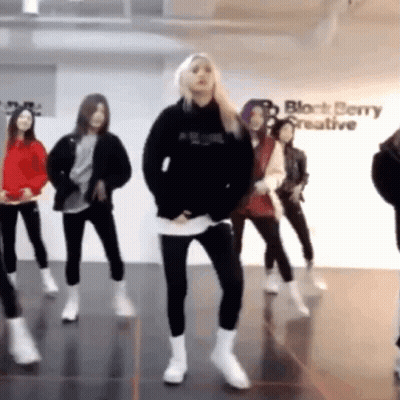 Man In Red Coat Dancing By Verizon Banner GIF