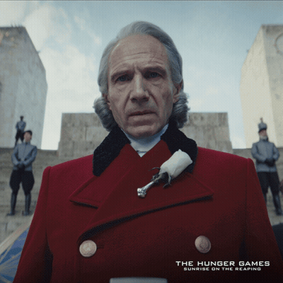 Man In Red Coat Hunger Games Sunrise On The Reaping GIF