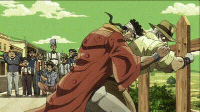 Man In Red Coat Next To Man In Hat In Front Of Crowd GIF