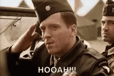 Man In Red Coat Saluting With Shotgun GIF