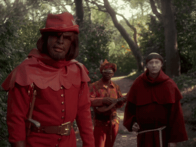 Man In Red Costume Playing Guitar GIF