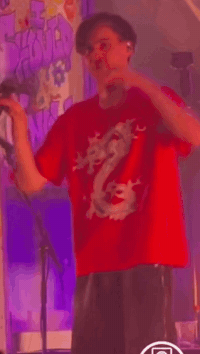 Man In Red Dragon Shirt Dancing On Stage GIF
